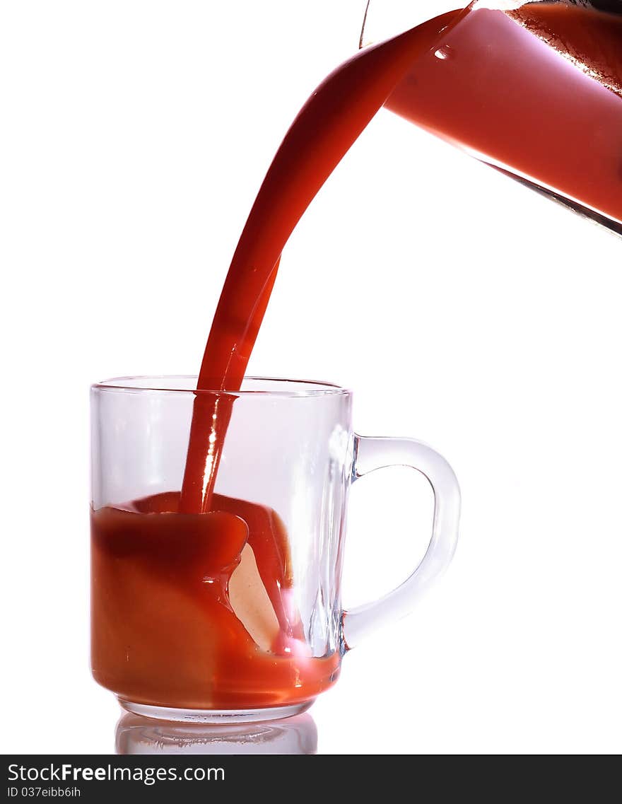 Tomato juice splash in glass white background