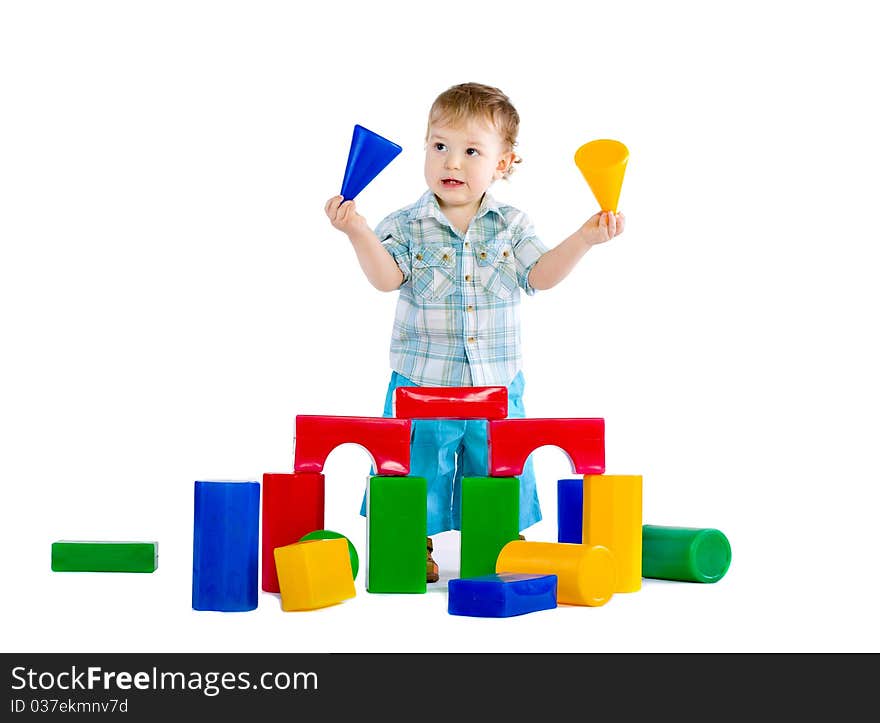 Cute little baby boy with colorful building blocks isolated on white