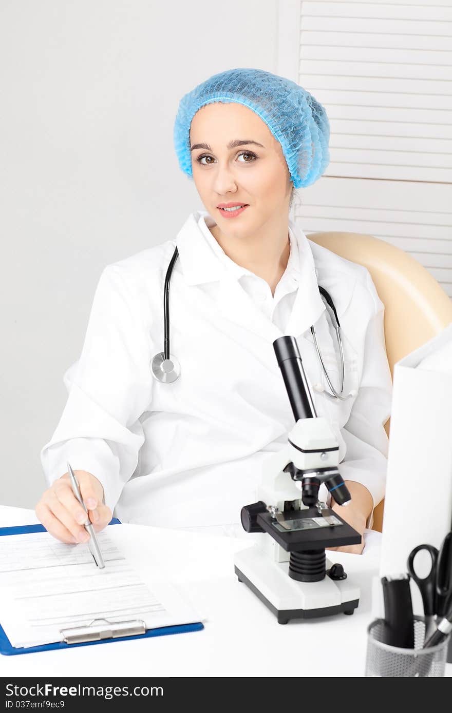 Medical - Female Nurse Looking In Microscope