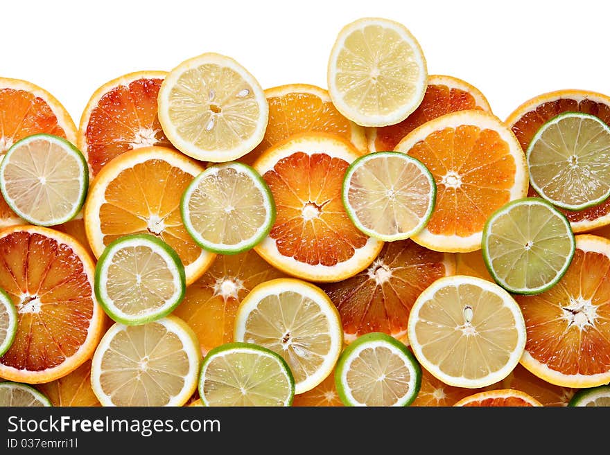 Slices of orange, lemon and limes - background, isolated on white