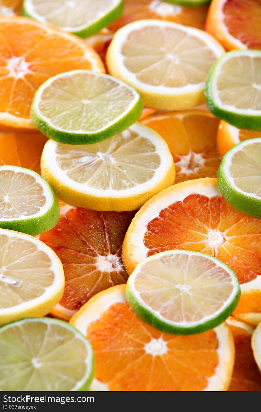 Slices of orange, lemon and lime - background