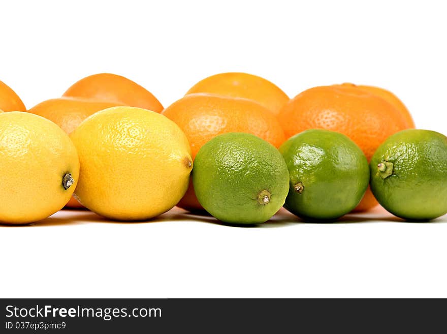 Whole oranges, lemons, limes - isolated on white