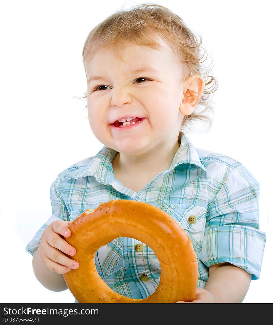 Little baby boy holding a bagel over white isolated