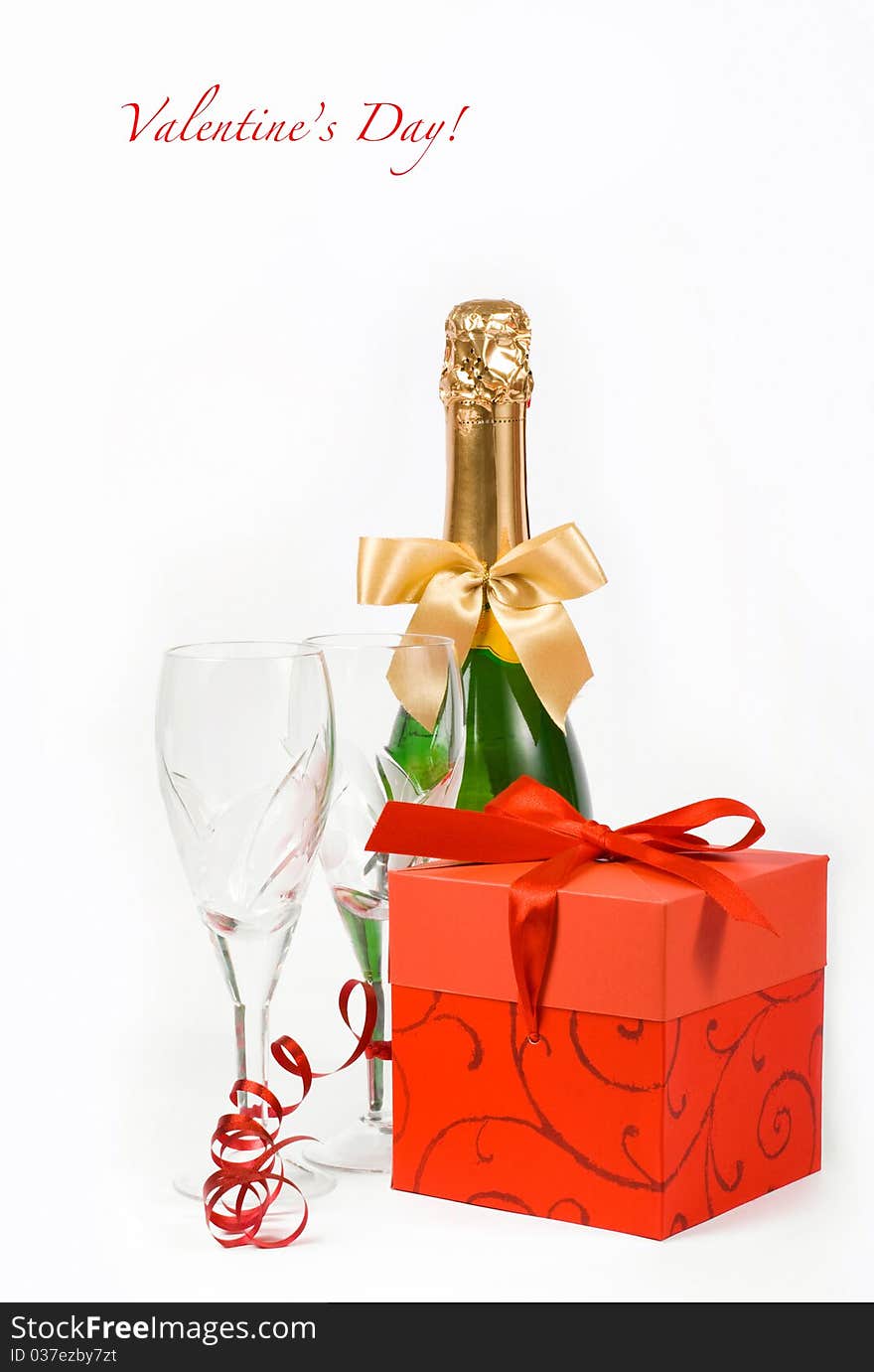 Gift in box, champagne and glasses on white background