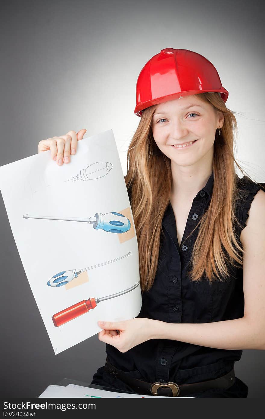 Young Design Engineer Woman Shows a Design Plan, with Grey Background