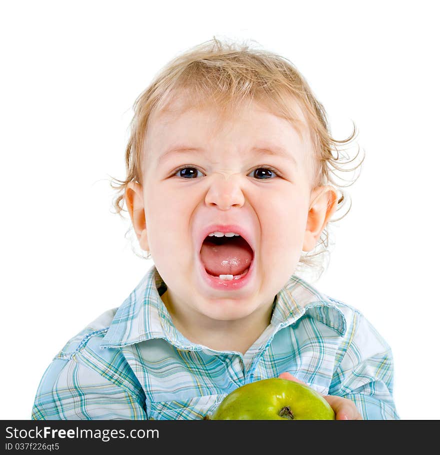 Beautiful baby boy eats green apple. Closeup portrait. Isolated.