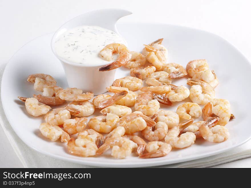 Fried shrimps on a plate and sauce