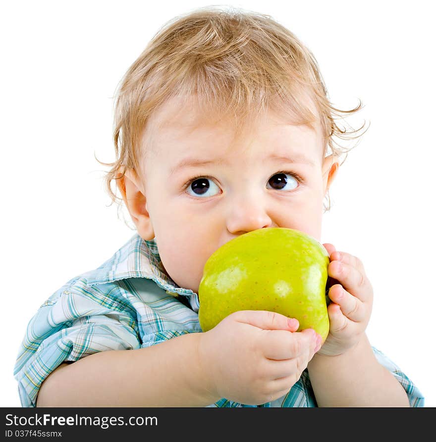 Beautiful baby boy eats green apple. Closeup portrait. Isolated.