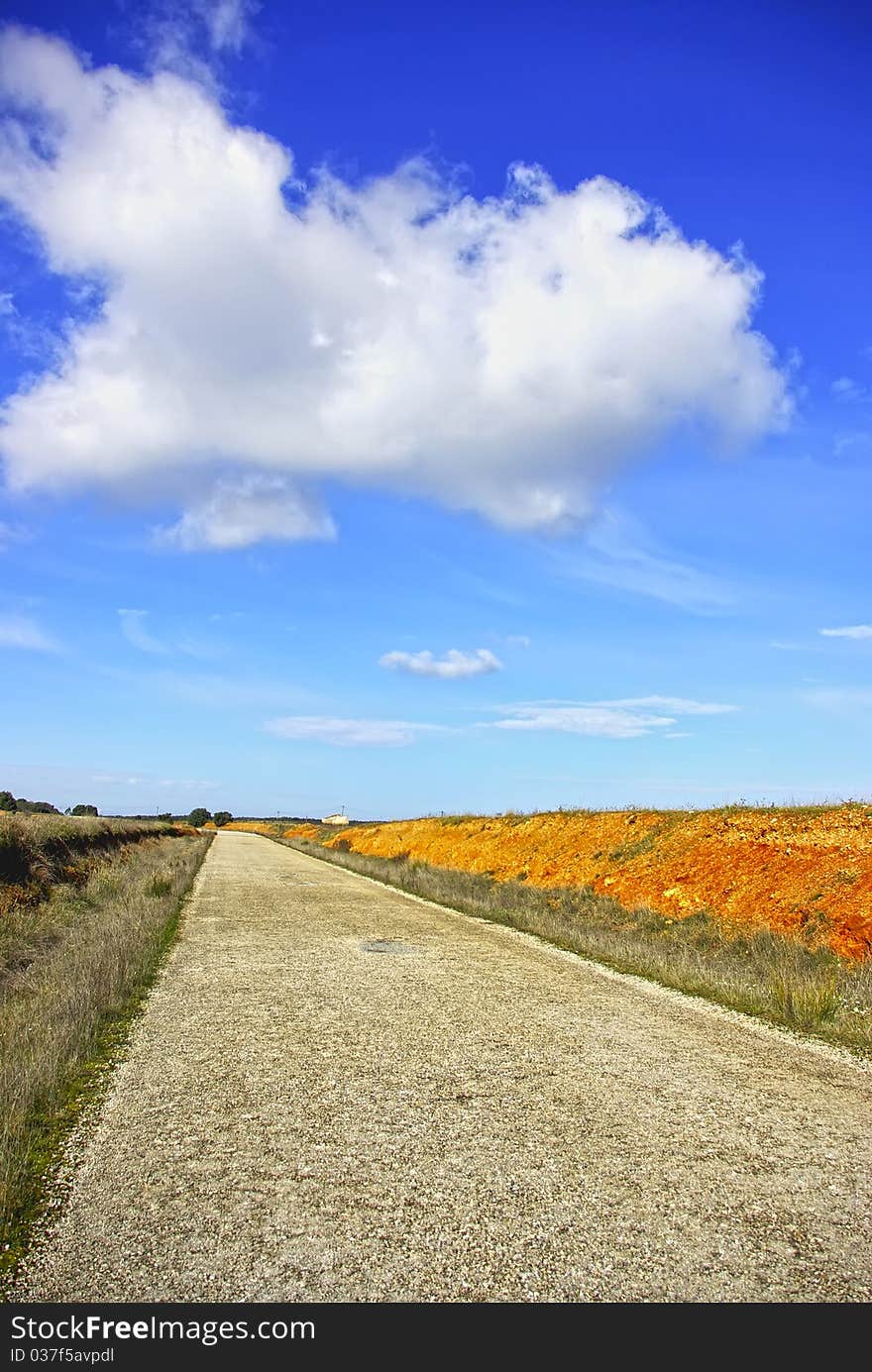 Old road and clouds at portuguese field. Old road and clouds at portuguese field.