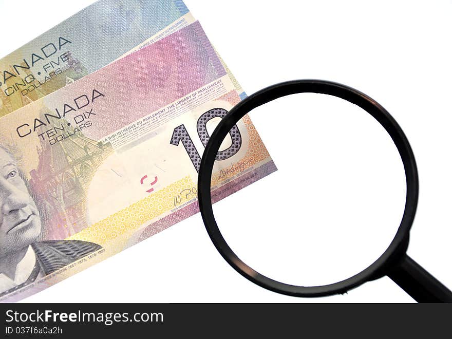 Magnifying Glass On Money Background