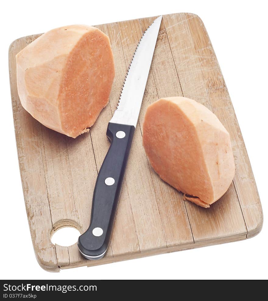 Sliced Sweet Potatoes on a Wooden Chopping Block