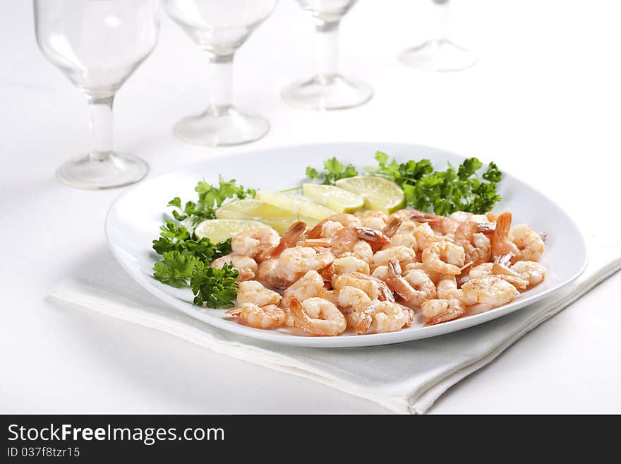 Shrimps on a plate with lime and parsley. Shrimps on a plate with lime and parsley