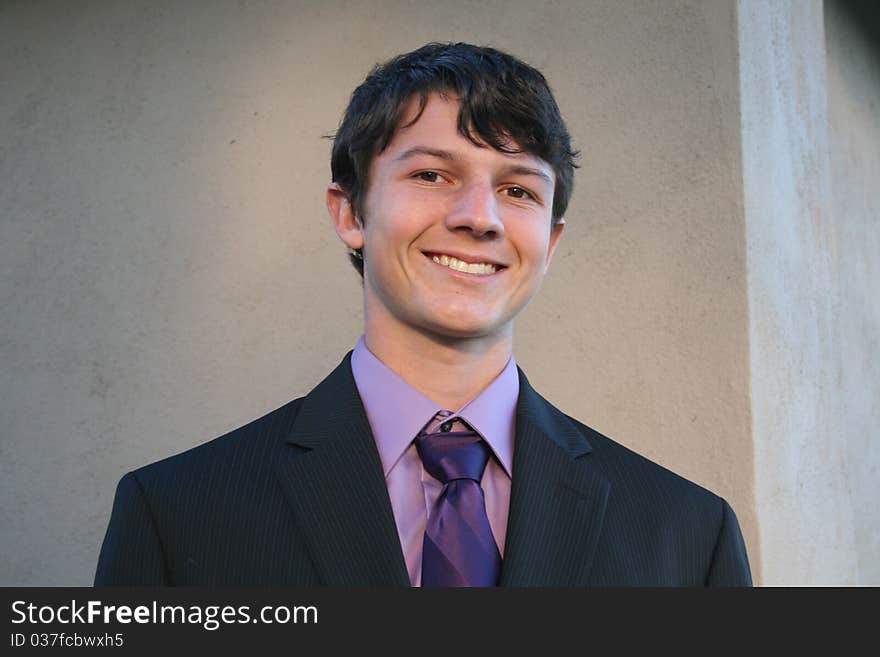 Young man dressed in suit and tie. Young man dressed in suit and tie.