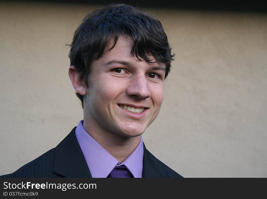 Young man dressed in a formal suit and tie. Young man dressed in a formal suit and tie.