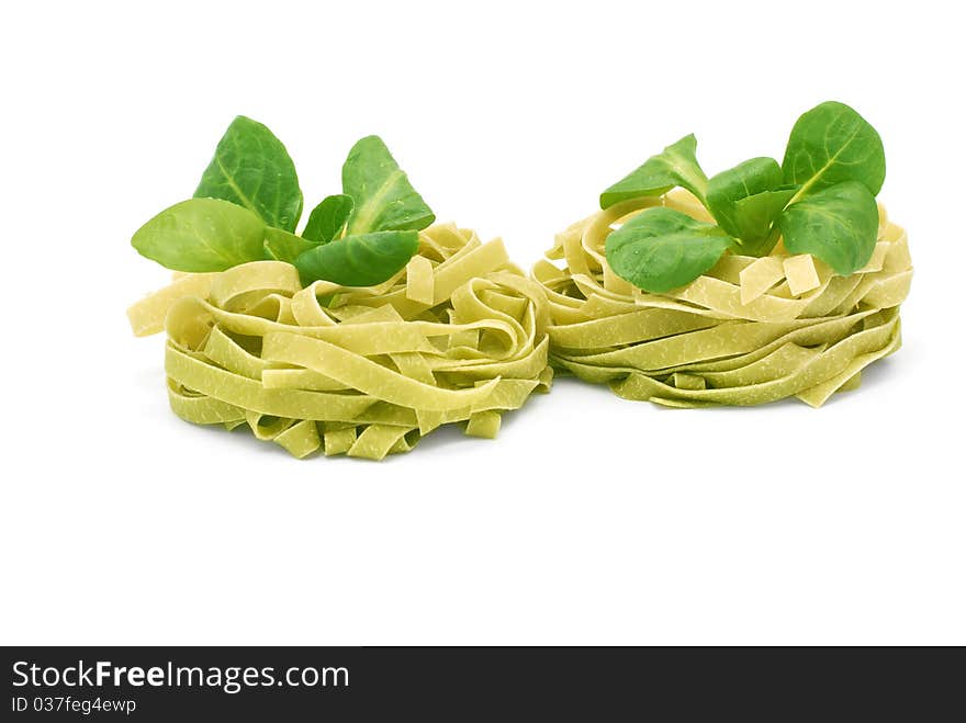 Italian pasta tagliatelle with corn salad on a white background