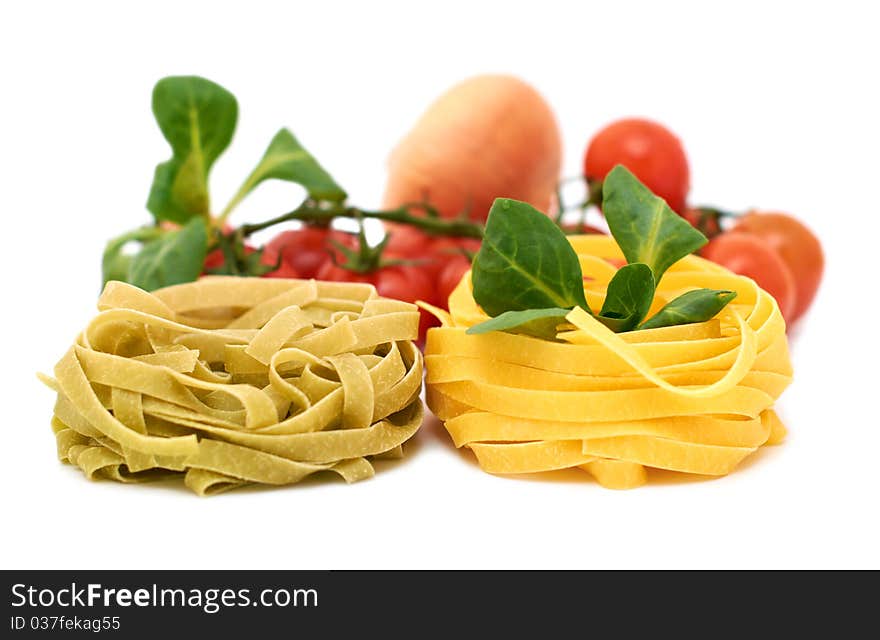 Italian pasta tagliatelle with vegetables on a white background