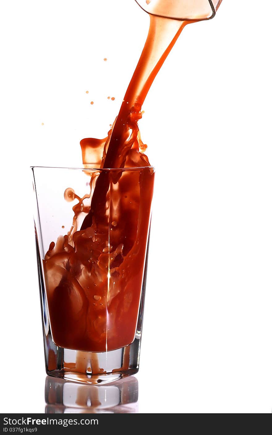 Tomato juice splash in glass white background