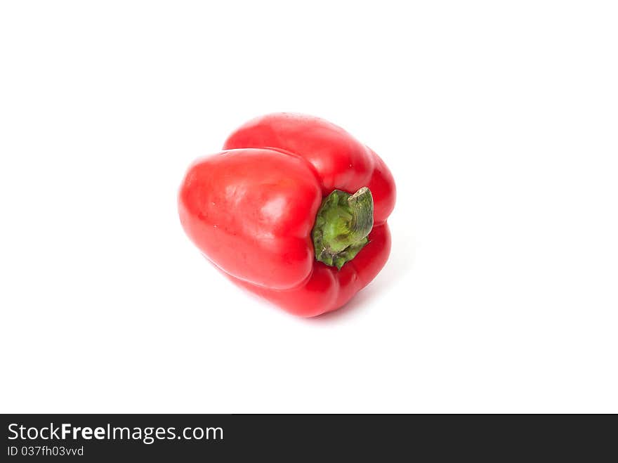 Delicous and fresh red bell pepper with green stem on white background. Delicous and fresh red bell pepper with green stem on white background