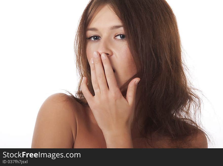 Young woman covering her mouth and yawn