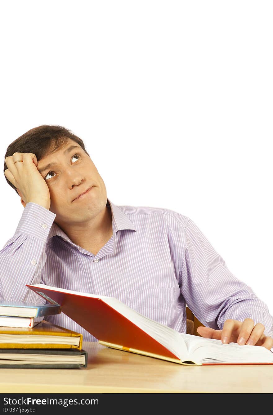 Young man c books on a table