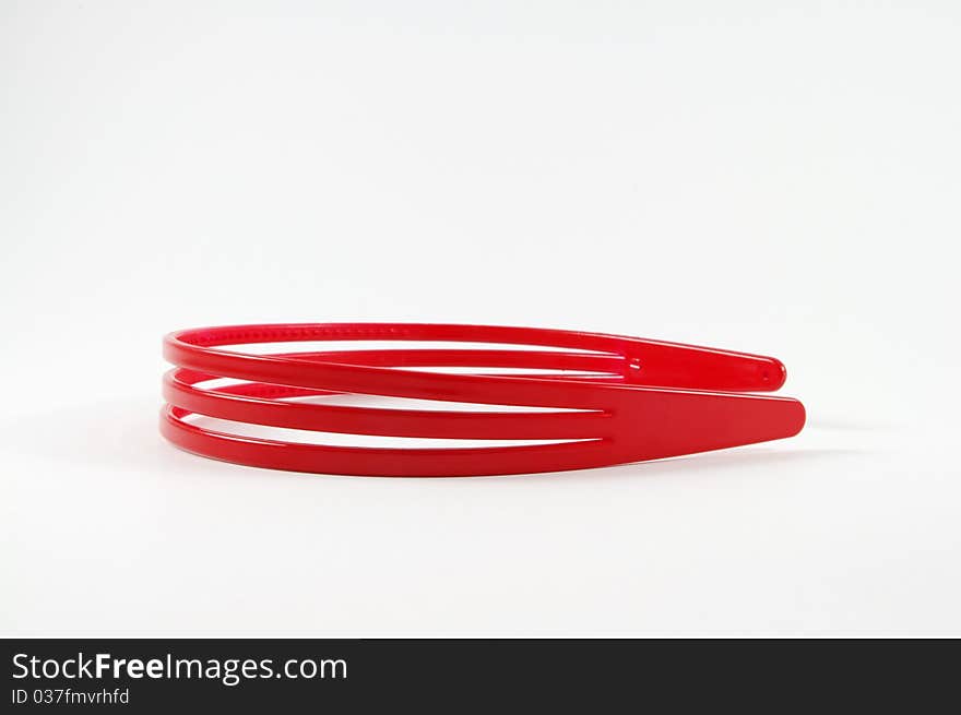 Red girl's hair holder isolated on background. Red girl's hair holder isolated on background