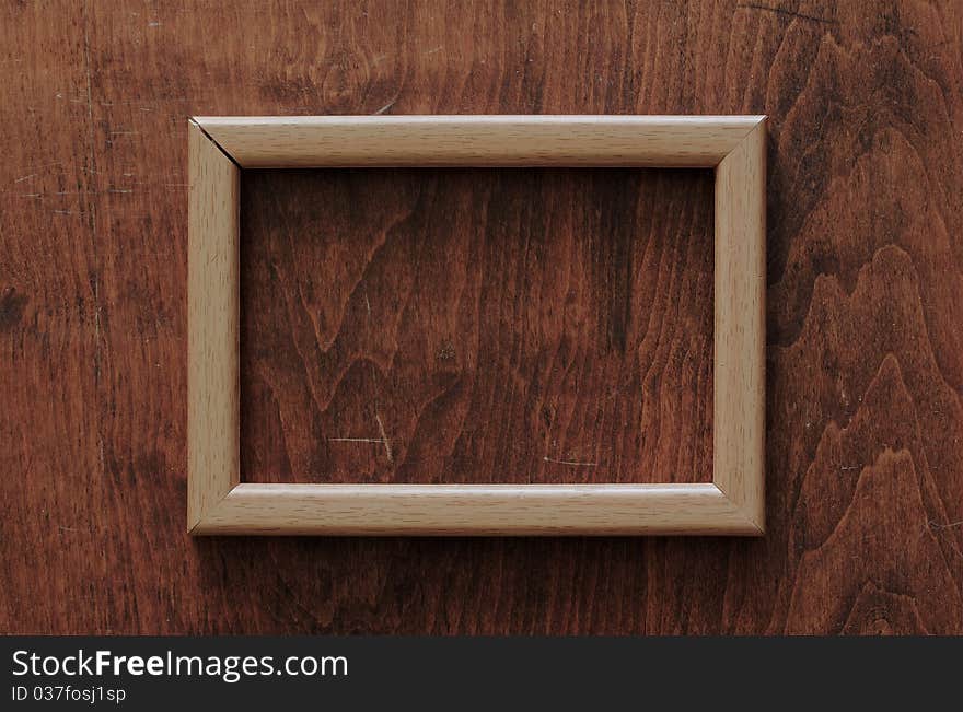 Blank frame on old wooden background