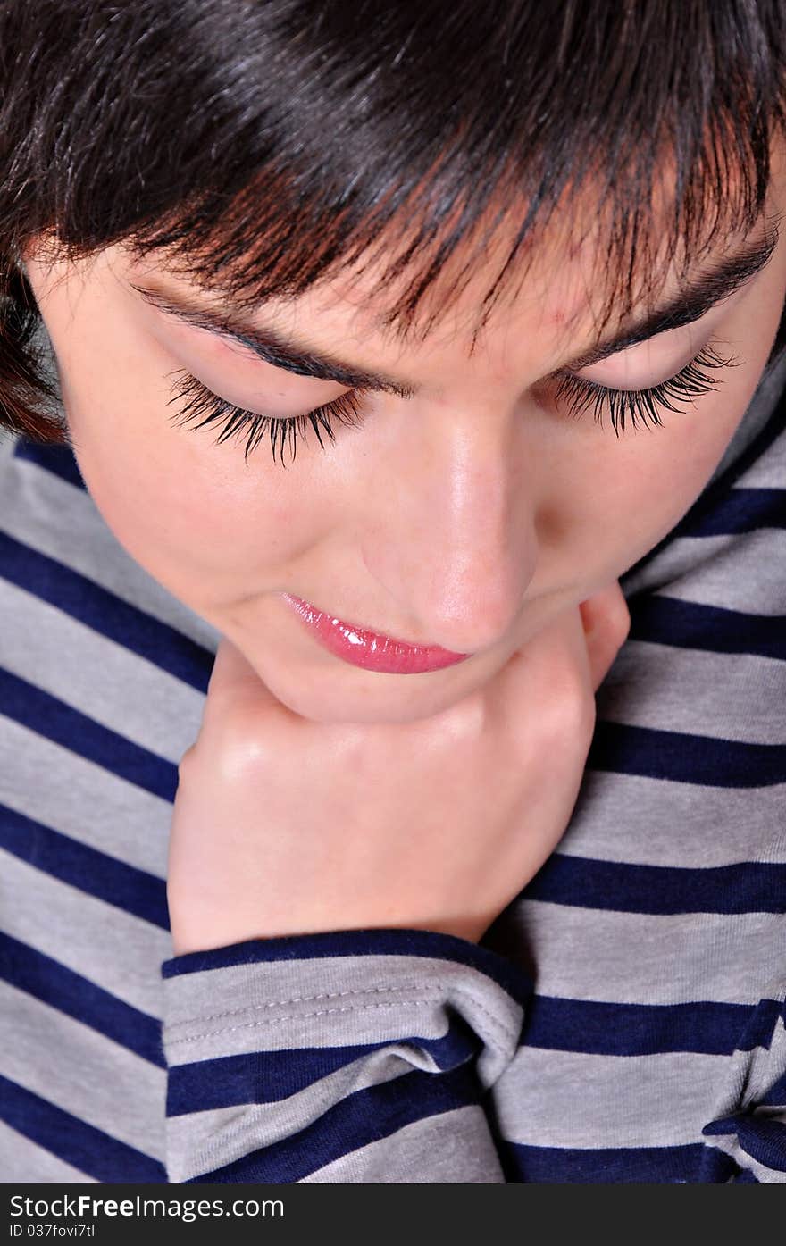 Close up of a beautiful young woman looking down