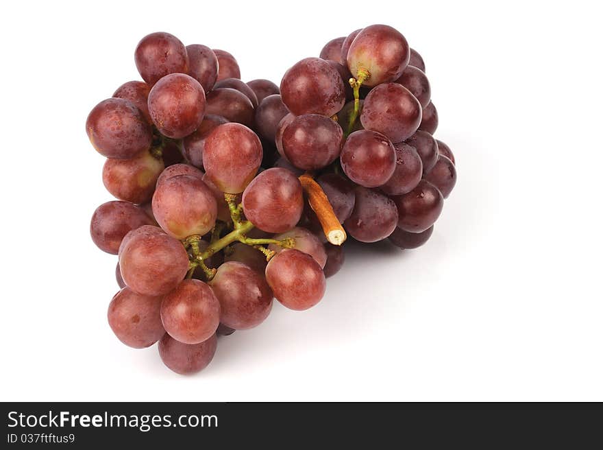 Red grapes isolated on white background.