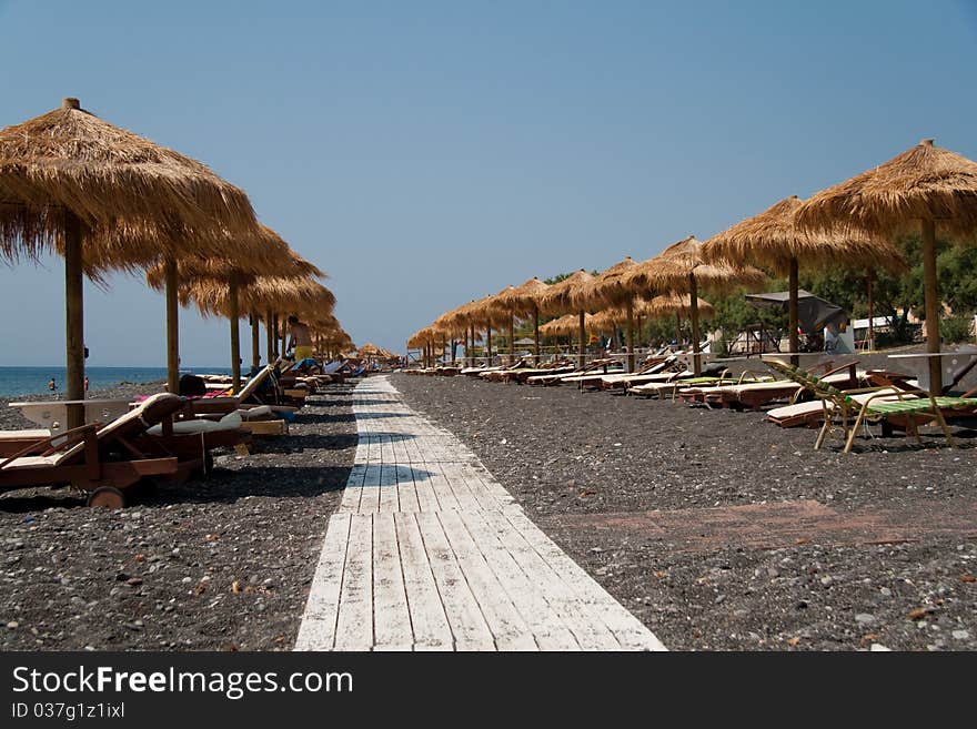 Santorini Perissa beach with black sand