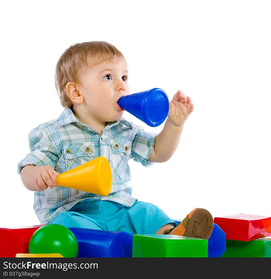 Cute little baby boy with colorful building blocks isolated on white