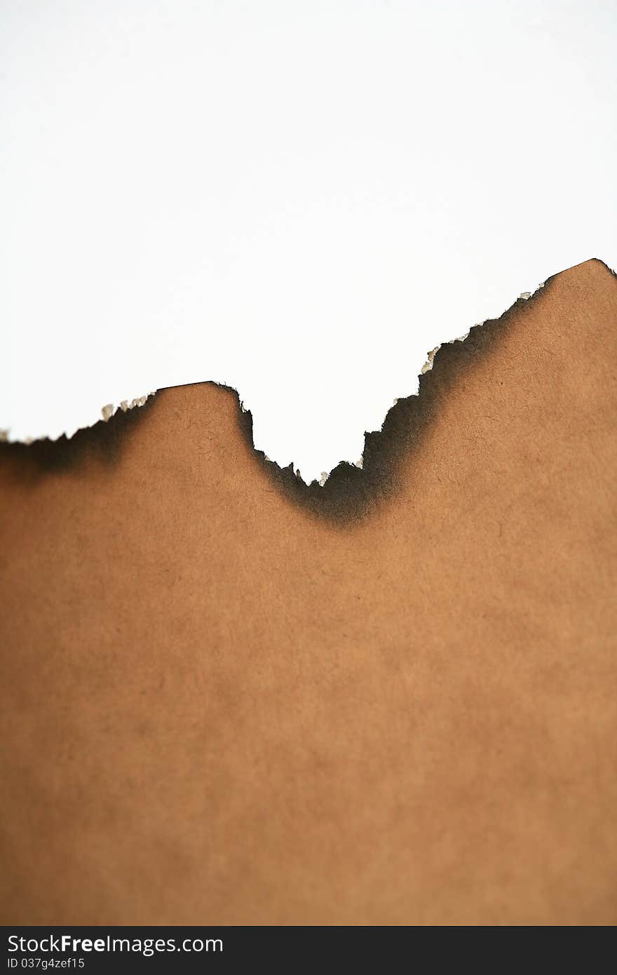 Burnt the edges of the old image of a brown colored paper. Burnt the edges of the old image of a brown colored paper