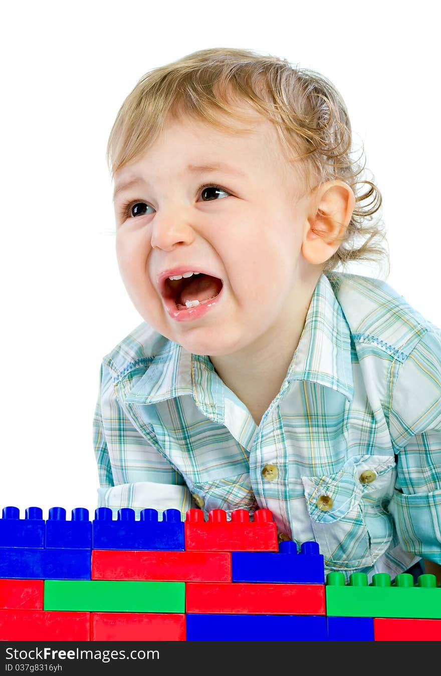 Cute little baby boy with colorful building blocks isolated on white