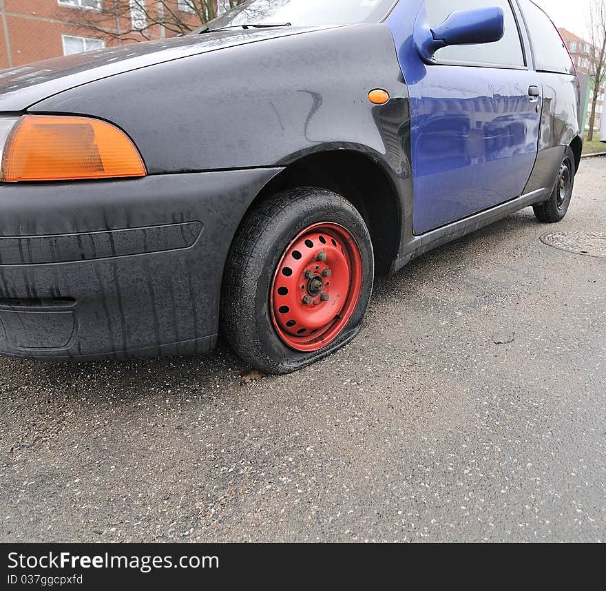 Car with flat tires on roadside. Car with flat tires on roadside