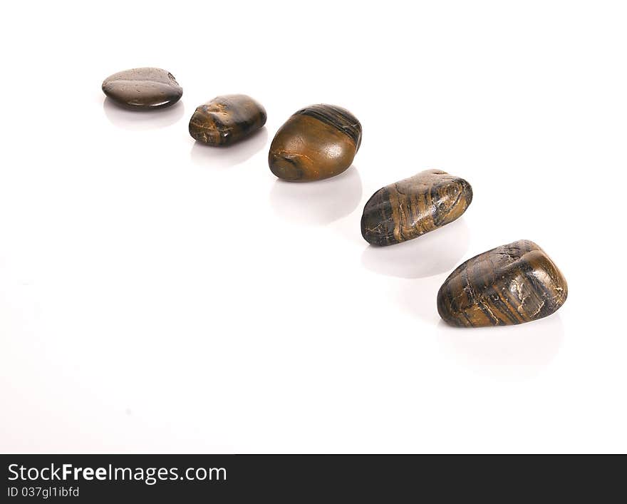 Five pebbles in a curved line