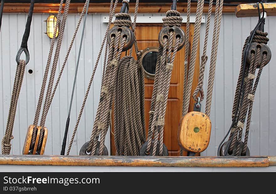 Row of Rope Pulleys on Old Sailboat. Row of Rope Pulleys on Old Sailboat