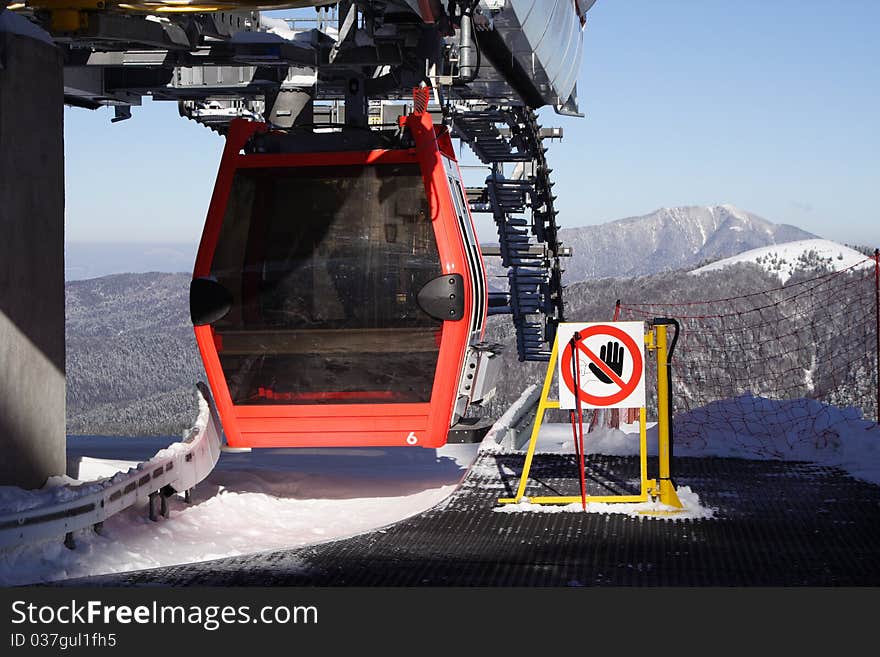 Forbidden sign at the edge of a ski gondola station