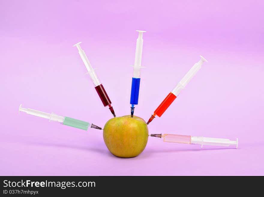 Five syringe in apple