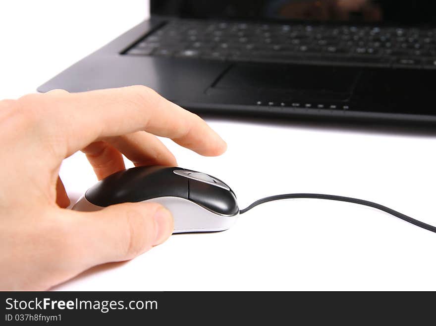 Hand clicking computer mouse isolated on white