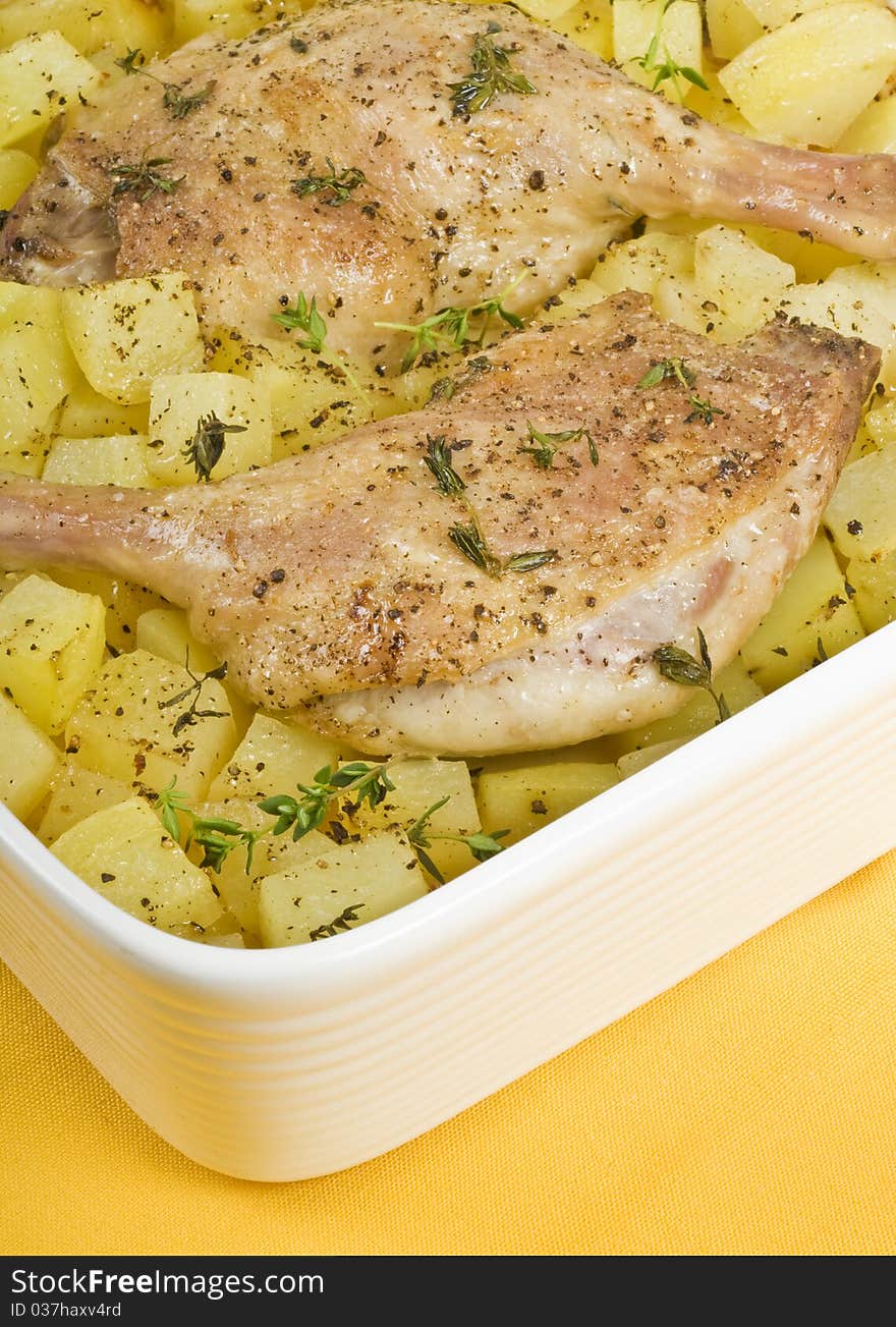 Slow roasted duck legs with potatoes and thyme. Slow roasted duck legs with potatoes and thyme.