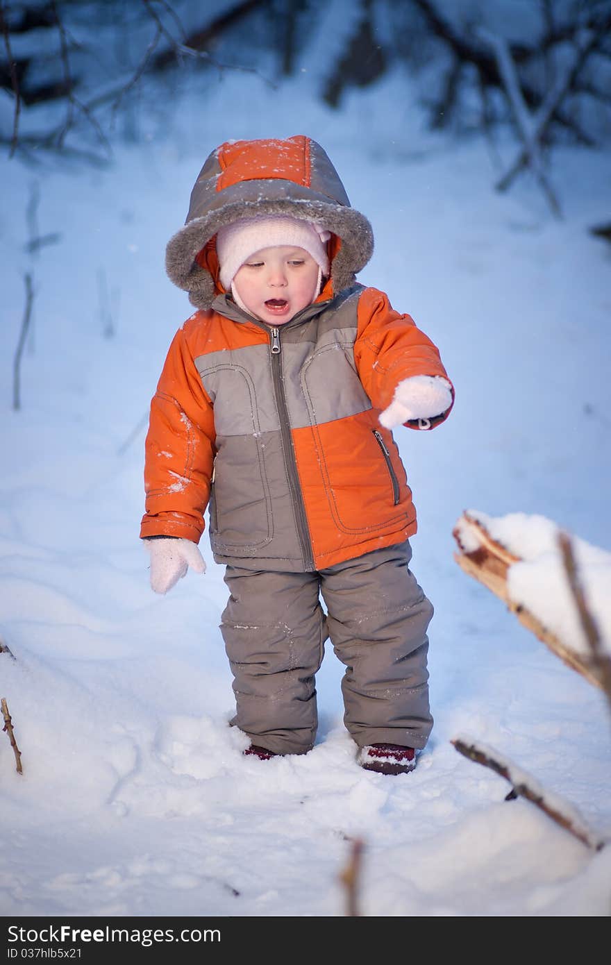 Adorable baby walking in evening park