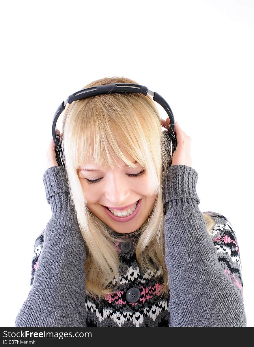 Pretty blond smiling and listening to music. Pretty blond smiling and listening to music