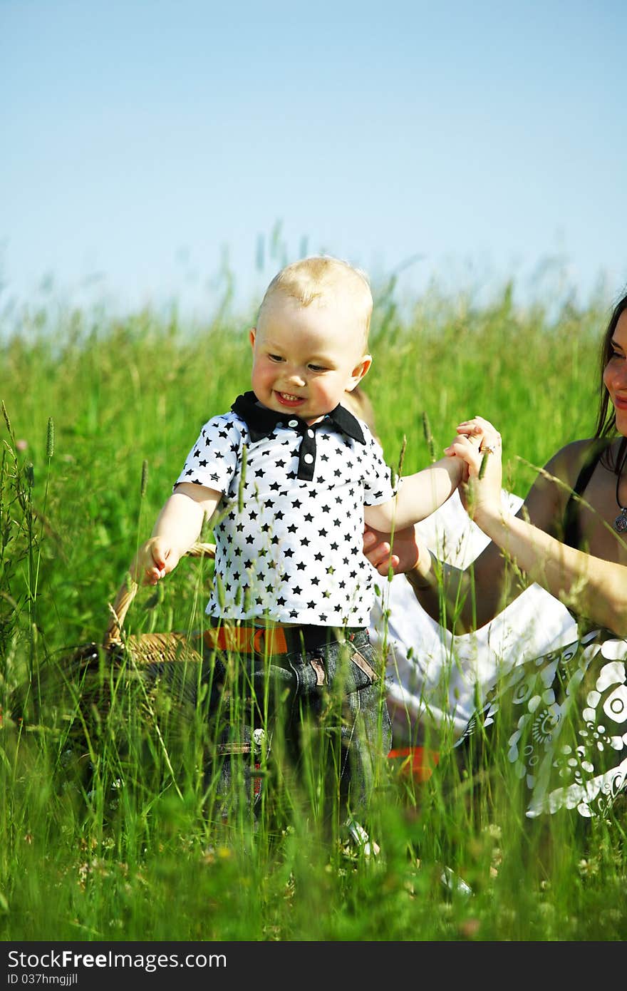 Happy family on picnic in green grass. Happy family on picnic in green grass