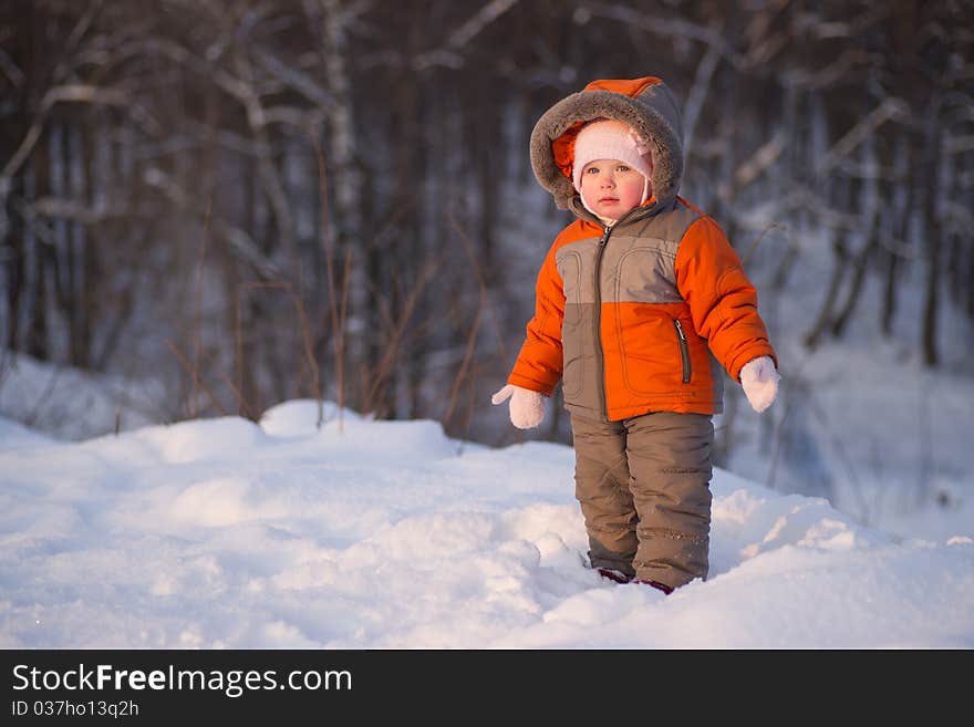 Cute adorable baby stay near mountain side