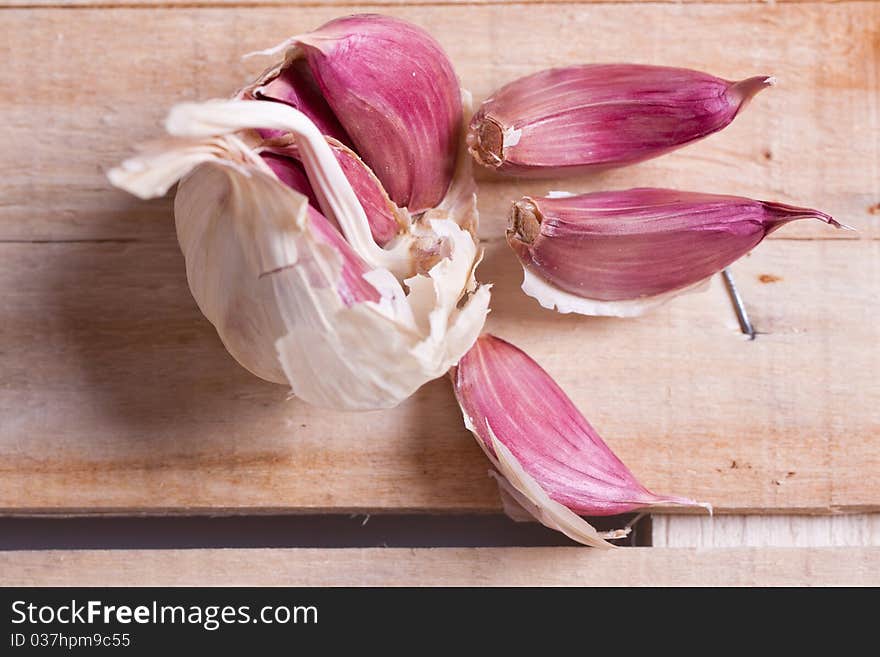 Close-up of garlic on old wood. Close-up of garlic on old wood