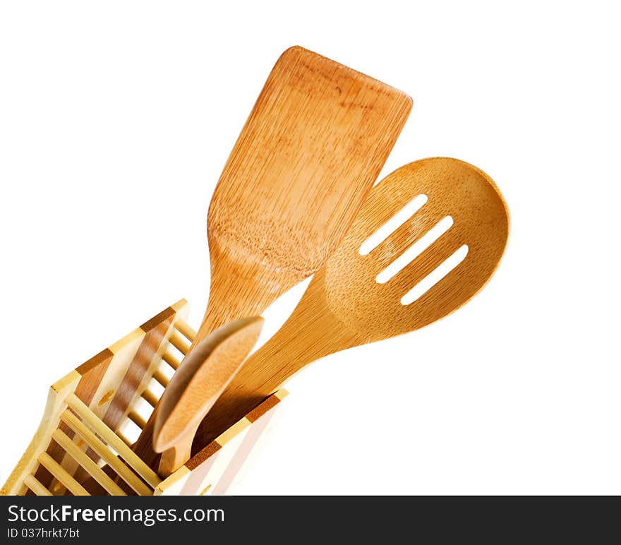 Set of kitchen utensils made of bamboo, white background. Set of kitchen utensils made of bamboo, white background