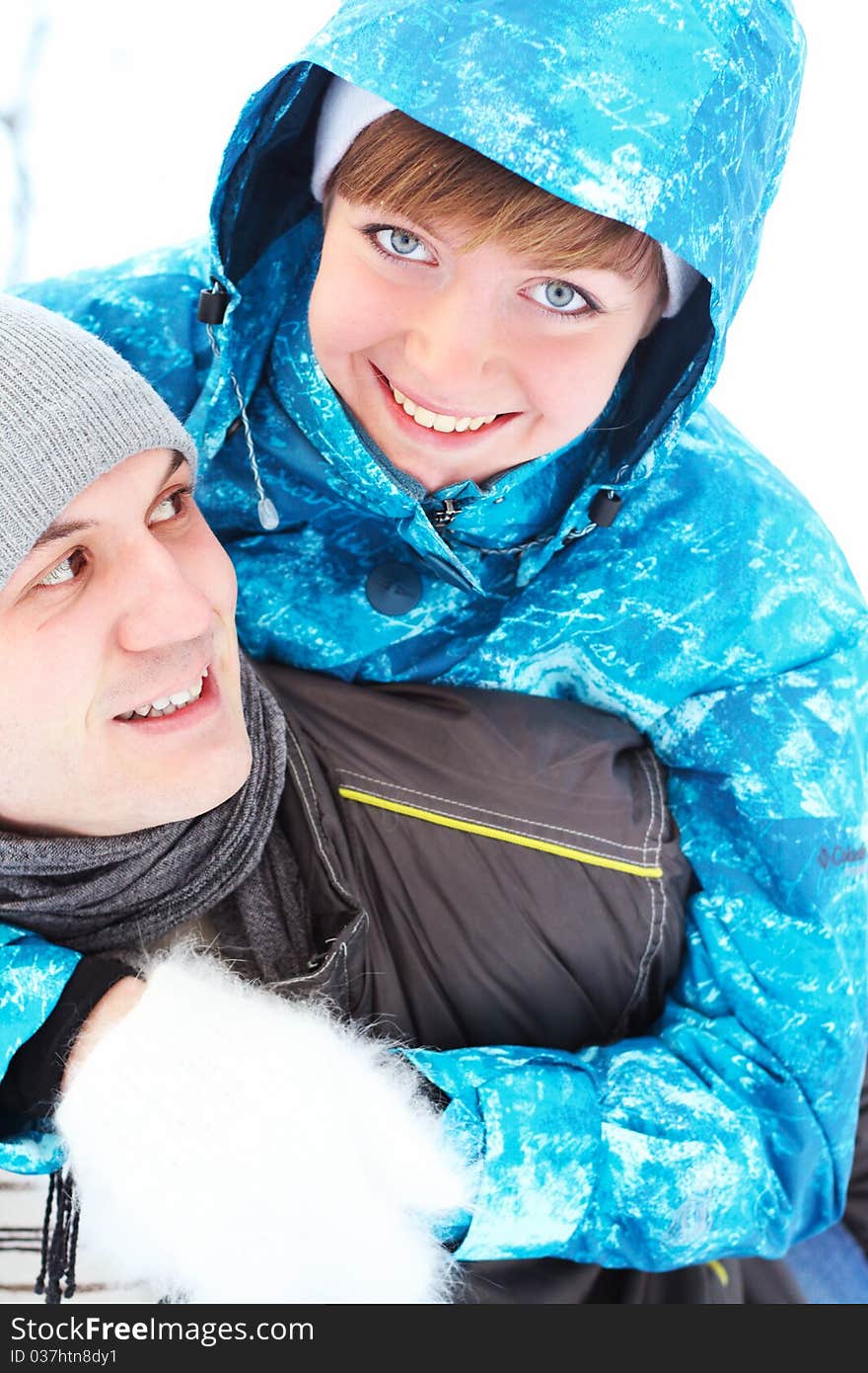 Young playful couple has a fun. winter