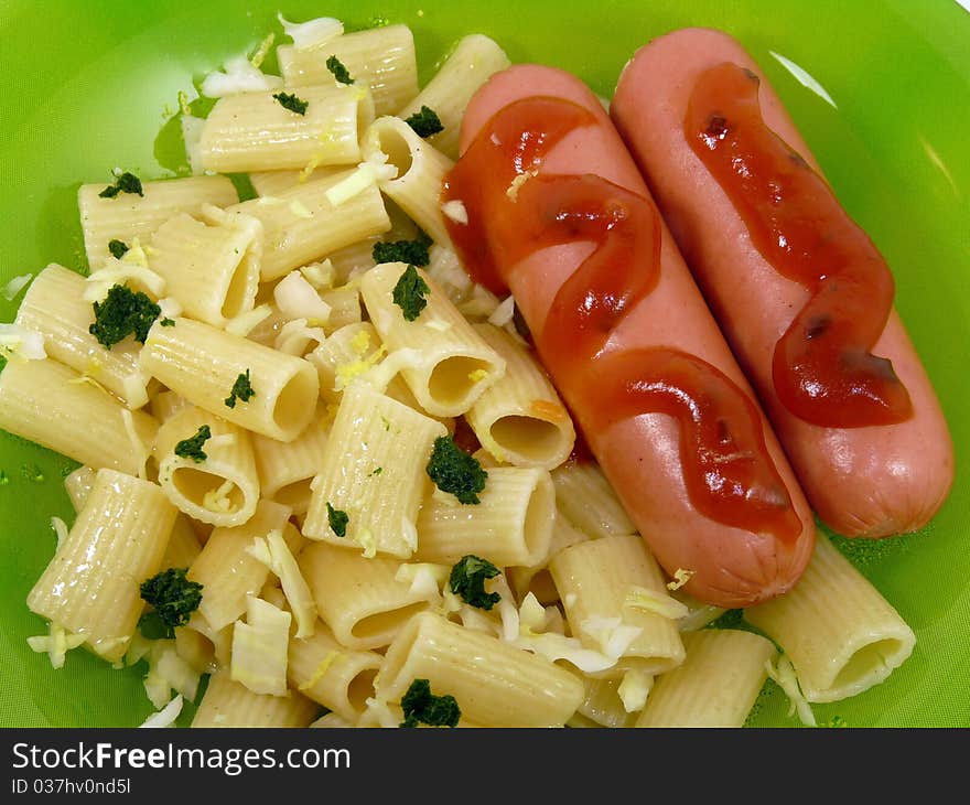 Delicious sausage with pasta isolated on white