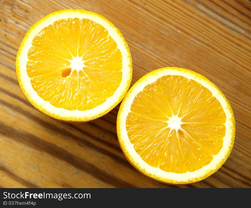 Orange slices on a wooden table. Orange slices on a wooden table