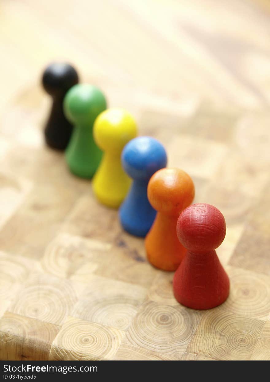 A row with board game counters in different colors