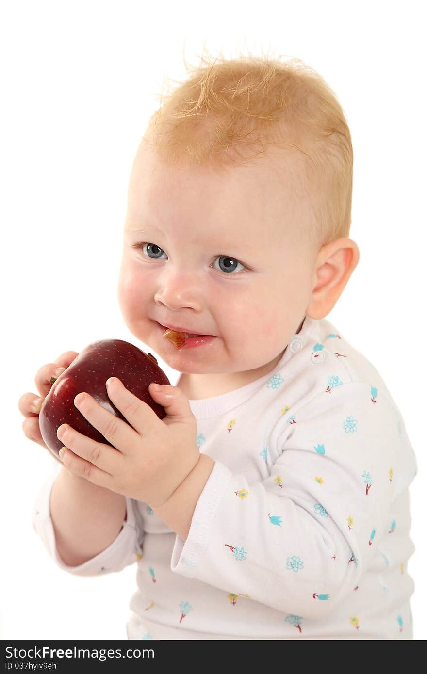 Portrait of a beautiful child with a red apple on a white background